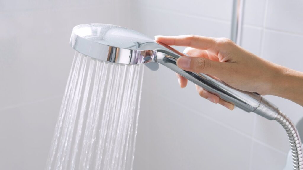 shower head photo for South Florida hard water affecting hair blog