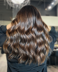 Brunette balayage with blended highlights created by stylist Lisa at Hair Culture Day Spa.
