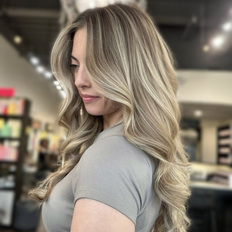 Gorgeous Bright Ash Blonde Balayage styled with soft hair waves. Blonde specialists at Hair Culture Day Spa, South Florida salon in Pembroke Pines FL. Master Stylist's work.